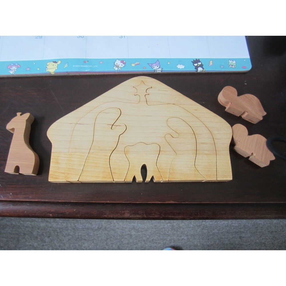 5 piece  SOLID WOOD  NATIVITY  PUZZLE PLUS 3 ANIMALS .  9" WIDE 5" HIGH.